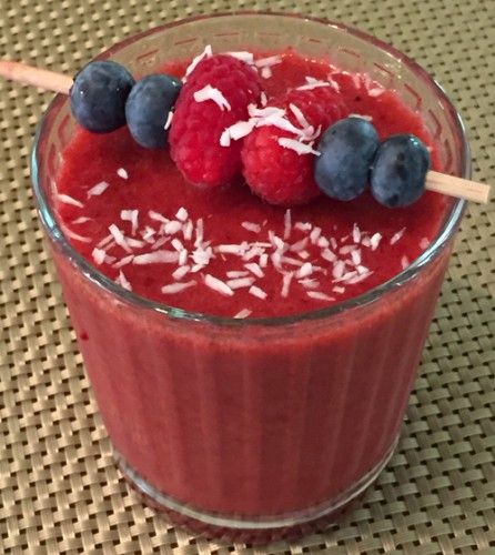 Berry Smoothie in a glass with berry garnish