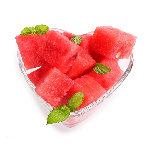 Watermelon Mint Salad in a clear heart-shaped glass bowl