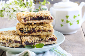 Stack of date squares with teapot in the background