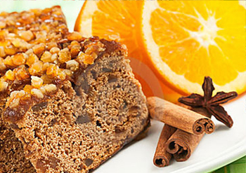 Ginger Bread with cinnamon stick and oranges in the background